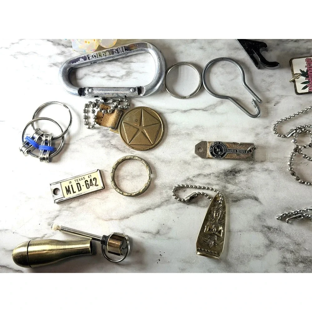 25 KEY RINGS ~BOTTLE OPENER, 150 LB CLIP, FIRE STARTER, BRACELET, ETC (3002)